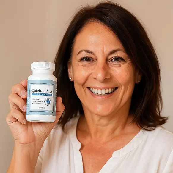 Smiling woman holding Quietum Plus